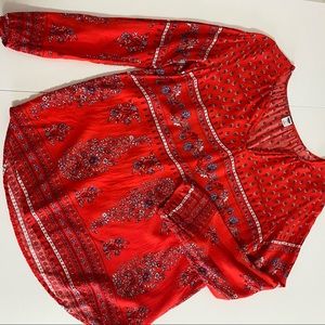 Red flowy blouse with white and mauve floral print